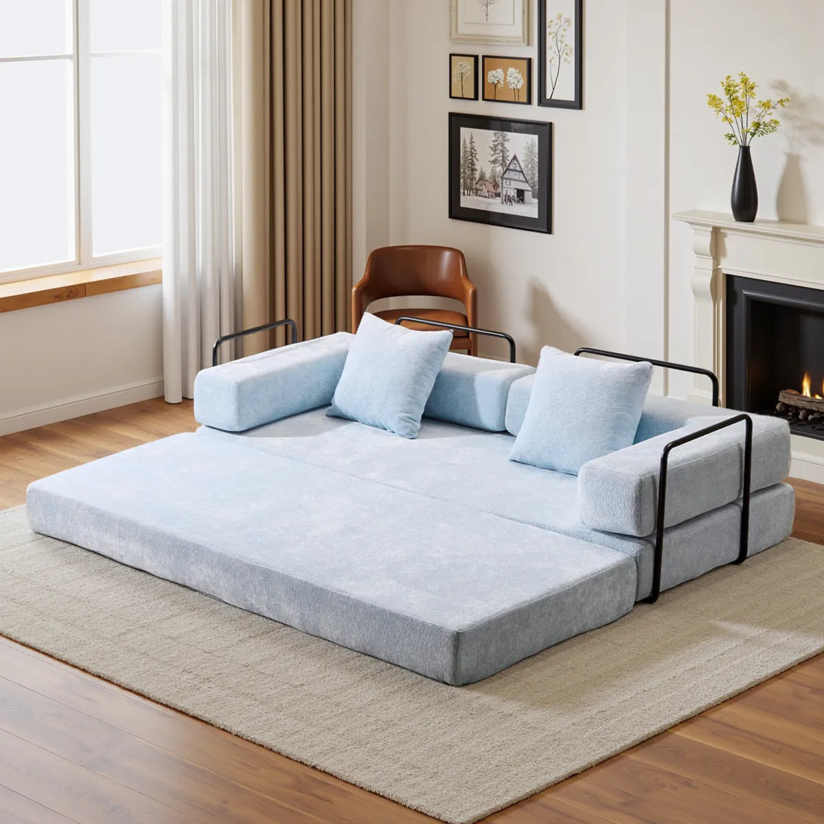 Blue chenille sofa bed unfolded into bed with black frame