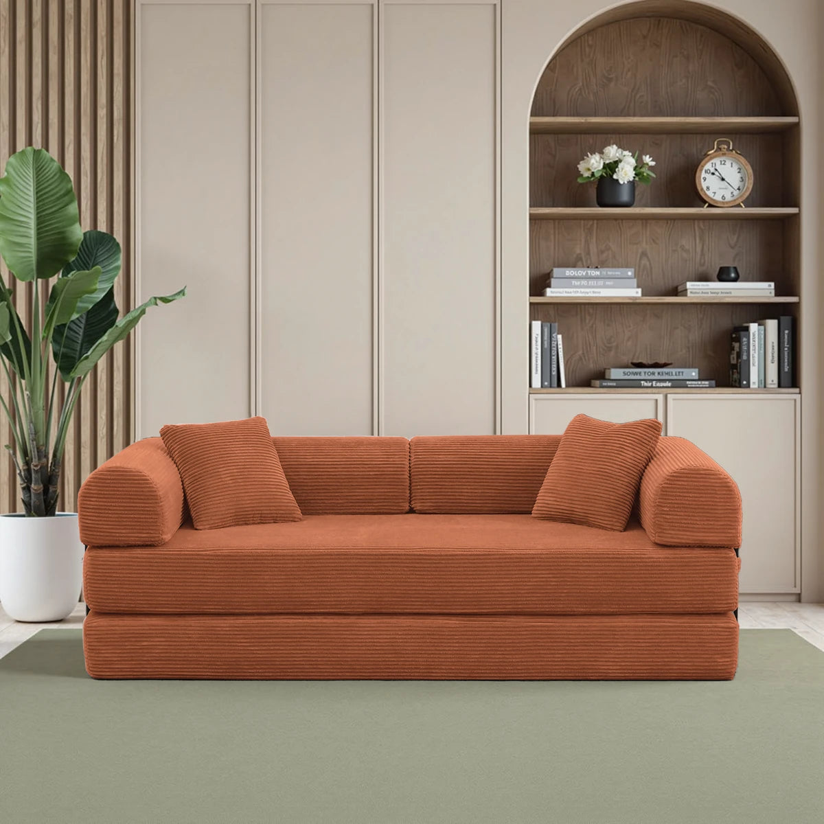 Orange corduroy sofa bed with black metal frame